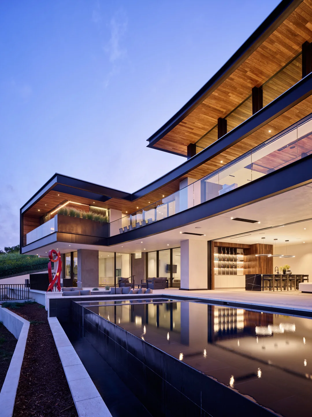 Contemporary residence at dusk with reflecting pool